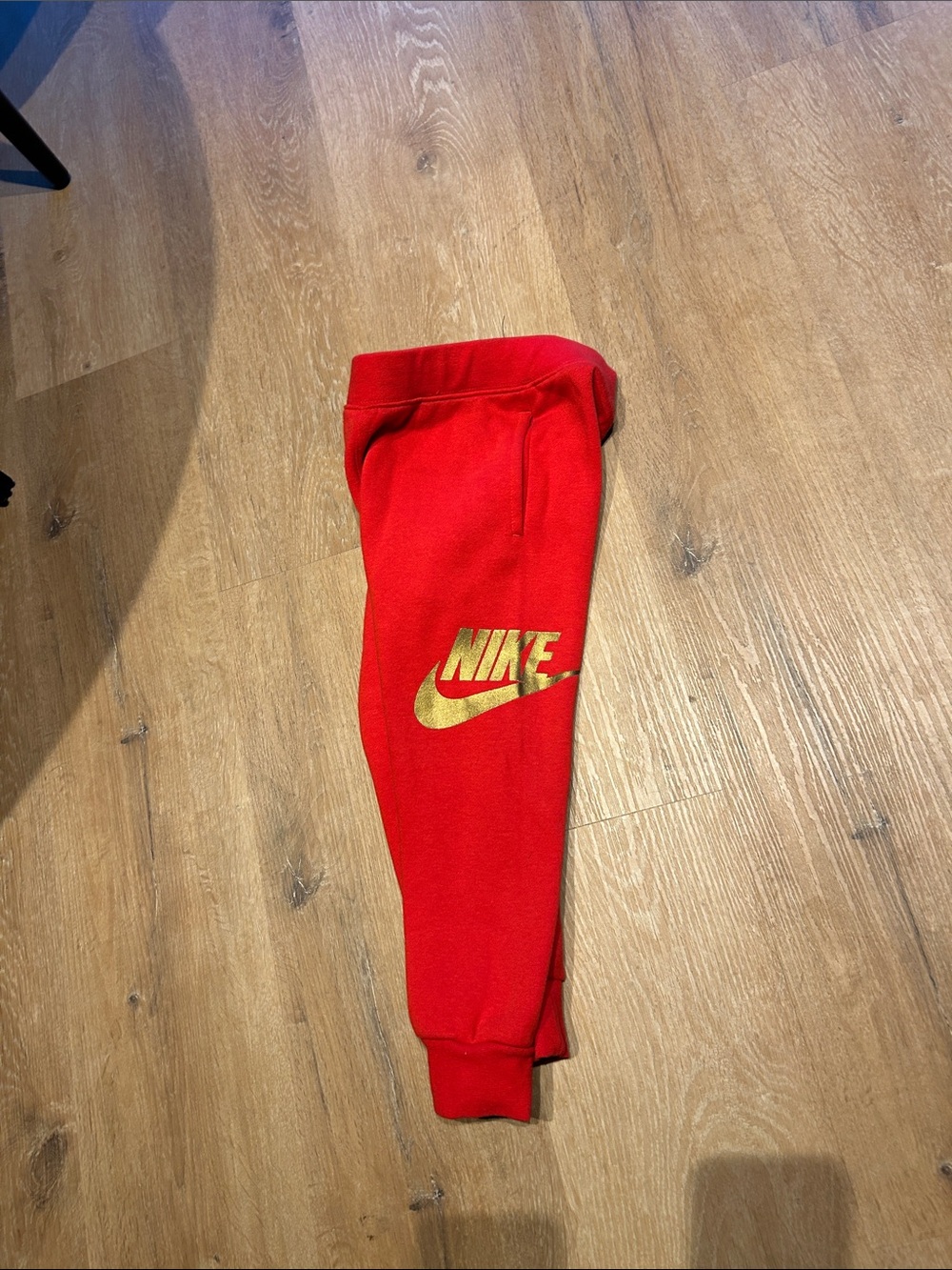 Nike Kids Red Jogger Sweatpants with Gold Logo